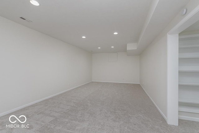carpeted spare room featuring recessed lighting and baseboards
