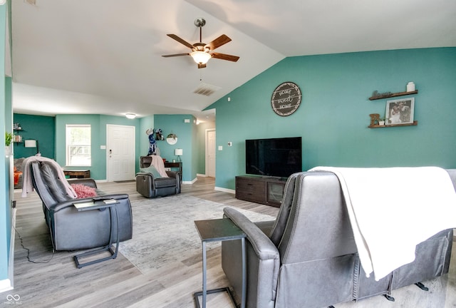 6190 E Ayrshire Cir, Camby, IN 46113 - living room featuring a ceiling fan, wood finished floors, vaulted ceiling, and baseboards
