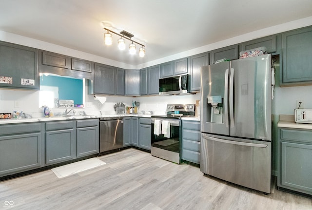 6190 E Ayrshire Cir, Camby, IN 46113 - kitchen with appliances with stainless steel finishes, light countertops, and light wood-style floors