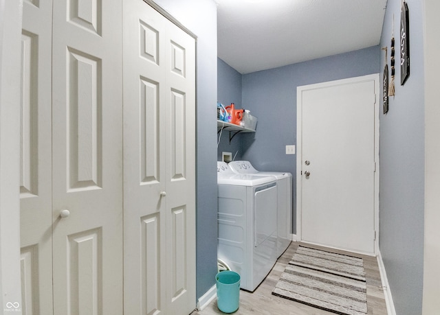 6190 E Ayrshire Cir, Camby, IN 46113 - laundry area featuring separate washer and dryer, light wood finished floors, and baseboards