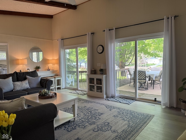 795 SE Santee Dr, Greensburg, IN 47240 - living area featuring wood finished floors, ceiling fan, beam ceiling, and a towering ceiling