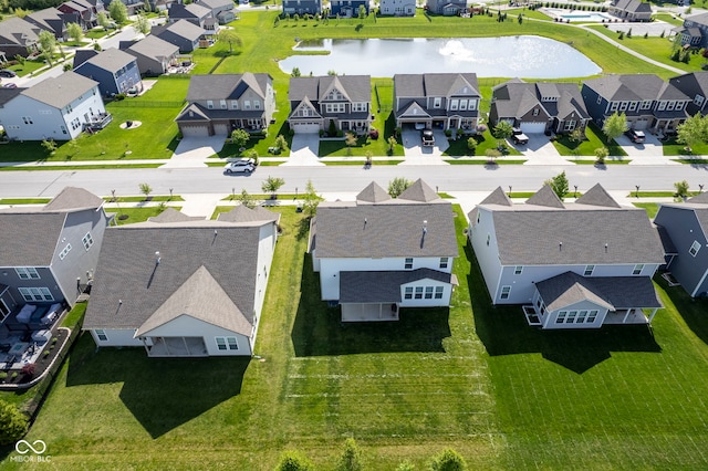 aerial perspective of suburban area featuring a nearby body of water