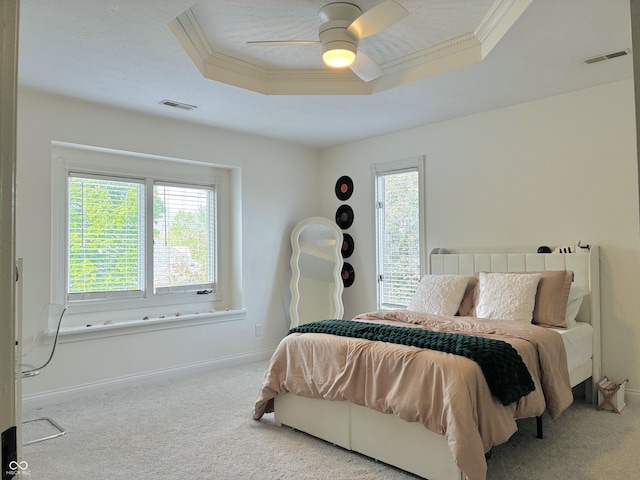 4601 Fairhope Dr, Indianapolis, IN 46237 - carpeted bedroom with a tray ceiling, ornamental molding, baseboards, and a ceiling fan