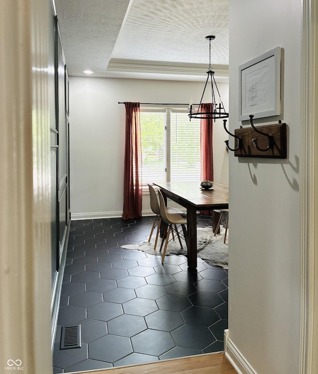 4601 Fairhope Dr, Indianapolis, IN 46237 - dining room featuring a chandelier, a textured ceiling, and baseboards