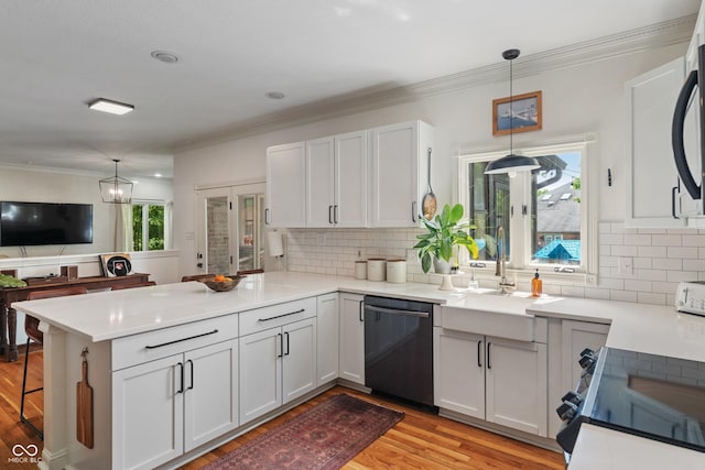 4601 Fairhope Dr, Indianapolis, IN 46237 - kitchen with dishwasher, a peninsula, light wood-type flooring, decorative backsplash, and white cabinets