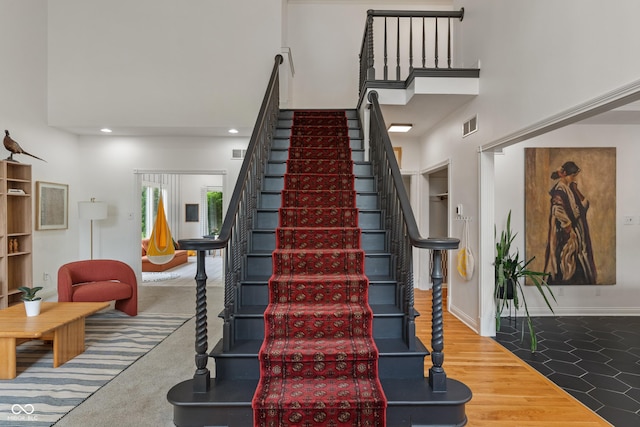 4601 Fairhope Dr, Indianapolis, IN 46237 - stairs with a high ceiling, recessed lighting, and baseboards