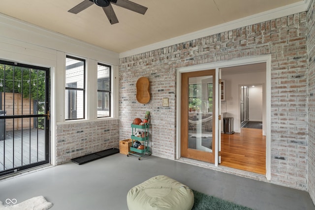 4601 Fairhope Dr, Indianapolis, IN 46237 - sunroom with brick wall and a ceiling fan
