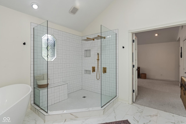 4601 Fairhope Dr, Indianapolis, IN 46237 - bathroom with a walk in shower, a freestanding bath, marble look tile flooring, lofted ceiling, and baseboards