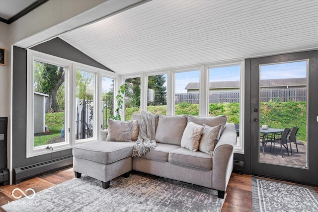 sunroom / solarium featuring a baseboard heating unit, vaulted ceiling, healthy amount of natural light, wood finished floors, and a wooden deck