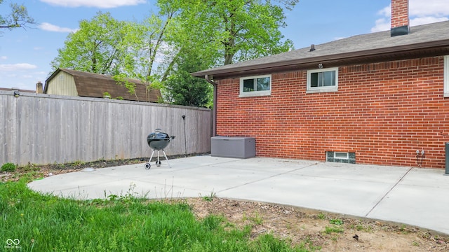 view of patio / terrace featuring fence