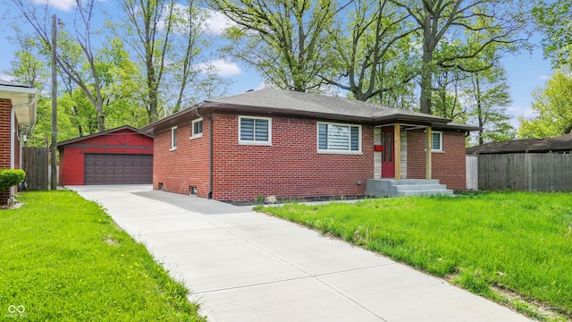 view of front of property with an outdoor structure, brick siding, and a detached garage
