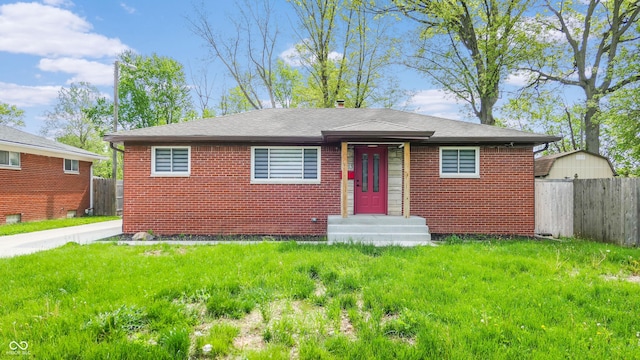 bungalow-style house with brick siding and a shingled roof