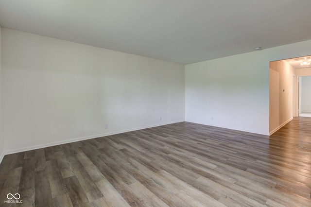 4956 W 11th St, Speedway, IN 46224 - spare room with wood finished floors and baseboards