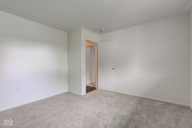 4956 W 11th St, Speedway, IN 46224 - carpeted spare room featuring baseboards and a smoke detector