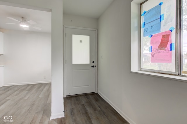 4956 W 11th St, Speedway, IN 46224 - entryway with wood finished floors, a ceiling fan, and baseboards