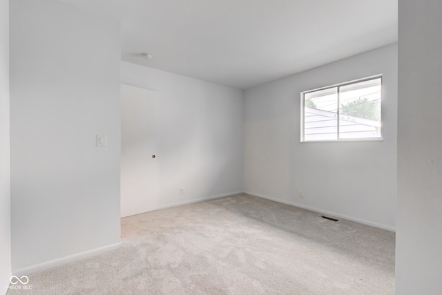 4956 W 11th St, Speedway, IN 46224 - carpeted empty room featuring baseboards and a smoke detector