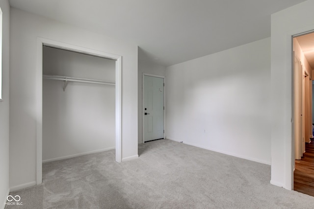 4956 W 11th St, Speedway, IN 46224 - unfurnished bedroom with carpet flooring, a closet, and baseboards