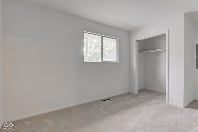 4956 W 11th St, Speedway, IN 46224 - unfurnished bedroom featuring carpet, baseboards, and a closet
