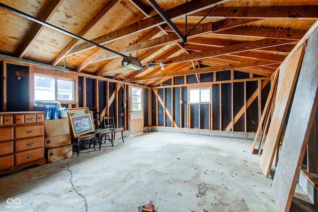 4956 W 11th St, Speedway, IN 46224 - misc room featuring a garage, plenty of natural light, lofted ceiling, and concrete flooring