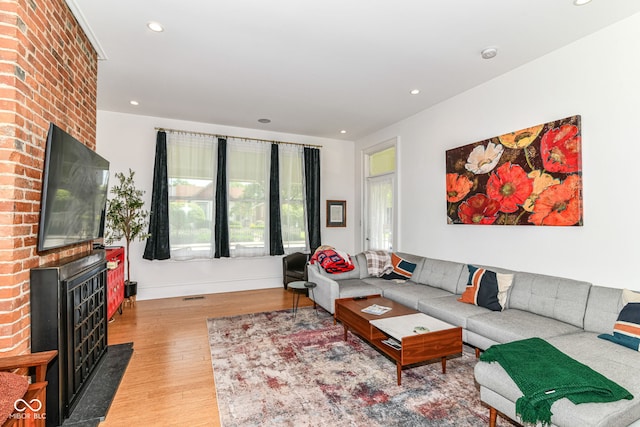 1630 N New Jersey St, Indianapolis, IN 46202 - living room featuring light wood-style floors, recessed lighting, a fireplace, and baseboards