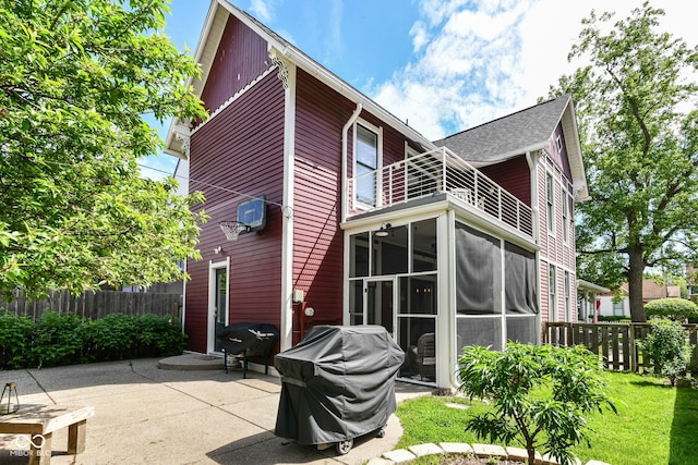 1630 N New Jersey St, Indianapolis, IN 46202 - rear view of house with a balcony, a patio area, and a sunroom