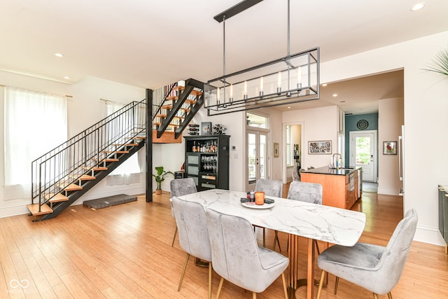 1630 N New Jersey St, Indianapolis, IN 46202 - dining area with stairway, light wood finished floors, recessed lighting, baseboards, and french doors