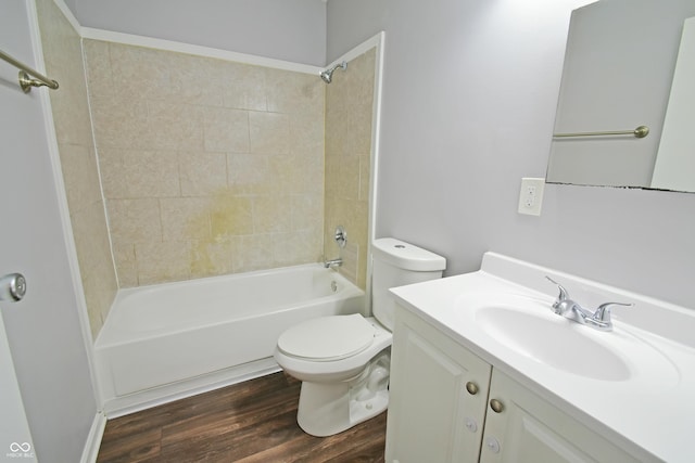 bathroom featuring toilet, shower / washtub combination, vanity, and wood finished floors