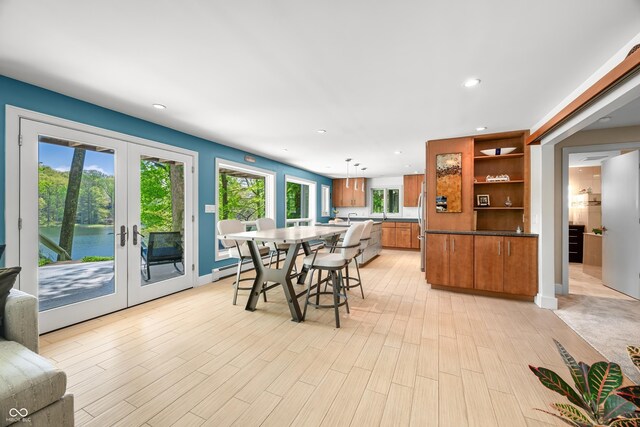 7753 Ivy Dr, Nineveh, IN 46164 - dining room featuring french doors, recessed lighting, a baseboard radiator, and light wood-style floors