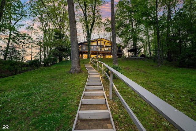 7753 Ivy Dr, Nineveh, IN 46164 - yard at dusk with a lawn and a deck
