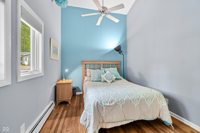 7753 Ivy Dr, Nineveh, IN 46164 - bedroom with a baseboard radiator, wood finished floors, baseboards, and a high ceiling