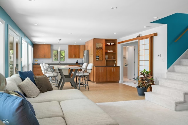 7753 Ivy Dr, Nineveh, IN 46164 - living area with light wood finished floors, recessed lighting, and stairs