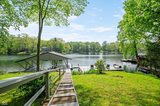 7753 Ivy Dr, Nineveh, IN 46164 - dock featuring a water view, boat lift, a yard, and a view of trees
