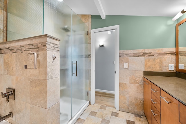 7753 Ivy Dr, Nineveh, IN 46164 - bathroom with tile walls, a shower stall, vanity, and stone finish floors