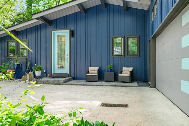 7753 Ivy Dr, Nineveh, IN 46164 - property entrance with board and batten siding and a patio area