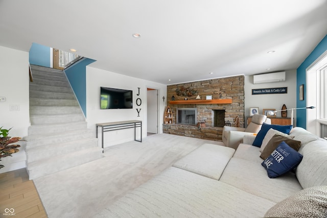 7753 Ivy Dr, Nineveh, IN 46164 - living room featuring a wall mounted air conditioner, stairs, wood finished floors, a stone fireplace, and recessed lighting