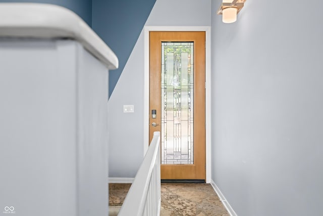 7753 Ivy Dr, Nineveh, IN 46164 - doorway to outside with baseboards and stone finish floors