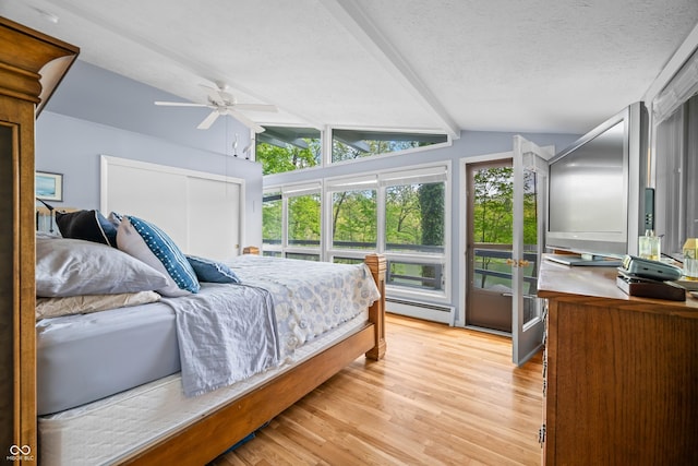 7753 Ivy Dr, Nineveh, IN 46164 - bedroom with light wood finished floors, baseboard heating, a textured ceiling, a closet, and a ceiling fan