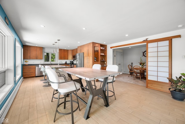 7753 Ivy Dr, Nineveh, IN 46164 - dining space featuring a baseboard heating unit, light wood-style flooring, and recessed lighting