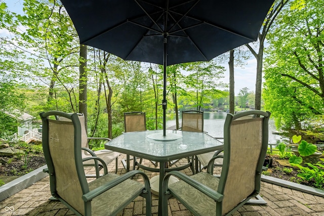 7753 Ivy Dr, Nineveh, IN 46164 - view of patio with outdoor dining area, view of wooded area, and a water view