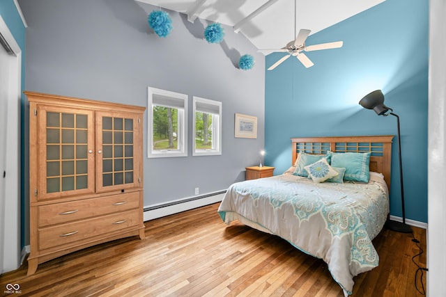 7753 Ivy Dr, Nineveh, IN 46164 - bedroom with a baseboard radiator, hardwood / wood-style flooring, high vaulted ceiling, beam ceiling, and baseboards