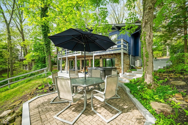 7753 Ivy Dr, Nineveh, IN 46164 - view of patio with a hot tub, outdoor dining space, stairway, and fence