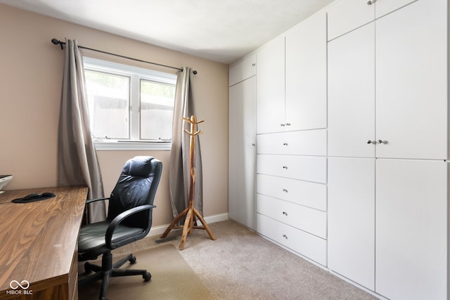 office featuring light carpet and baseboards