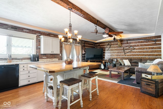 kitchen with dishwasher, wood counters, a kitchen bar, white cabinetry, and light wood-type flooring
