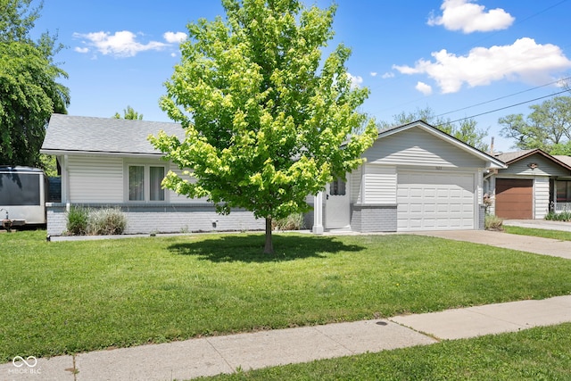 view of front of property featuring brick siding, a front yard, concrete driveway, an attached garage, and a shingled roof