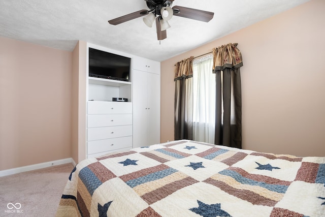 bedroom featuring carpet floors, baseboards, and ceiling fan