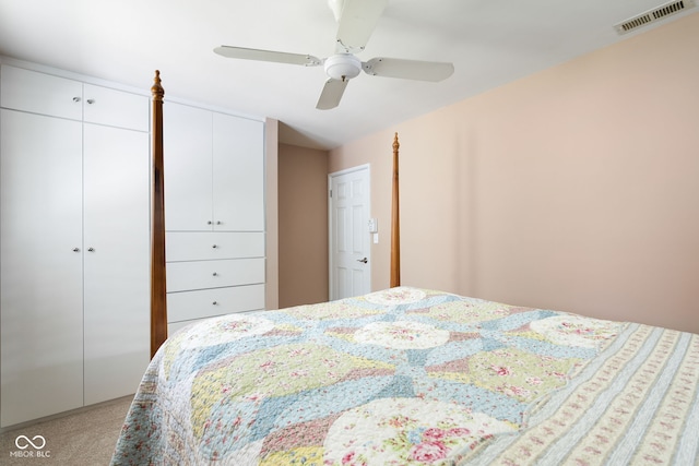 bedroom with light carpet and ceiling fan