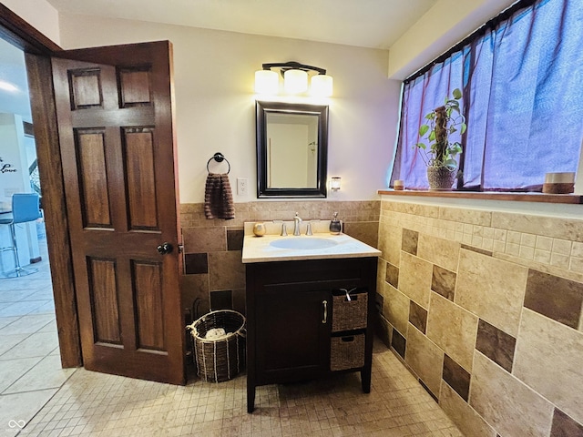 3081 Woodridge Rd, Shelbyville, IN 46176 - bathroom featuring tile walls, a wainscoted wall, and vanity