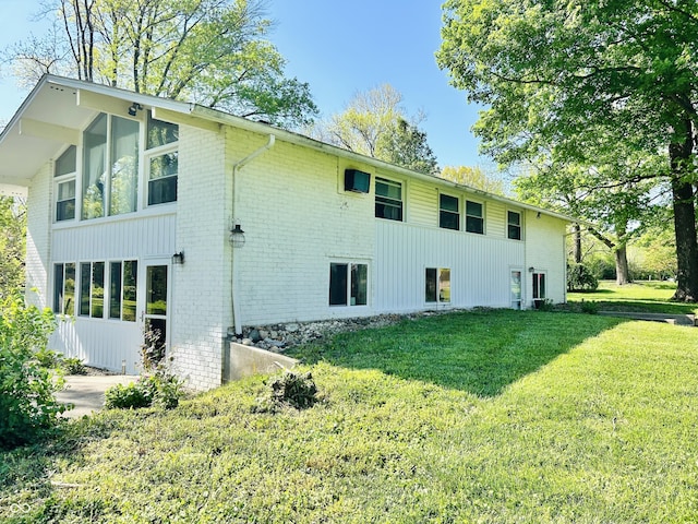 3081 Woodridge Rd, Shelbyville, IN 46176 - view of side of property with brick siding and a lawn