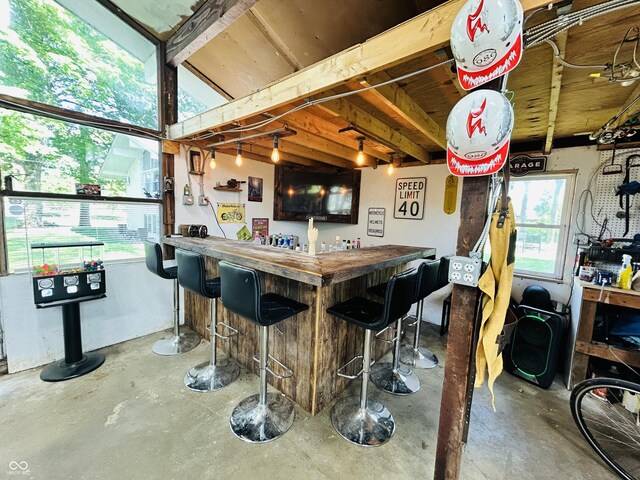 3081 Woodridge Rd, Shelbyville, IN 46176 - indoor dry bar with concrete flooring and plenty of natural light