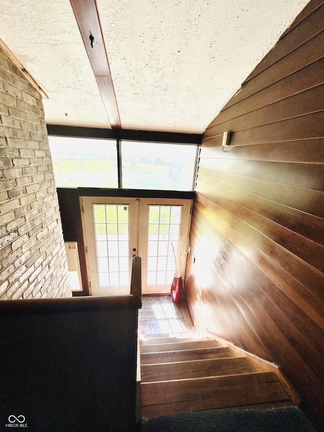3081 Woodridge Rd, Shelbyville, IN 46176 - doorway to outside with french doors, a textured ceiling, wood finished floors, and wood walls